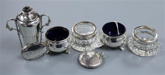 A pair of George V silver salts with liners, a pair of silver mounted glass salts, a silver pill box, a silver wine label etc.